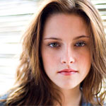 Kristen Stewart almost falls out of plunging red gown at beau’s film premiere 
