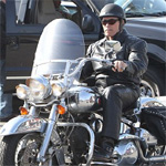 Arnold Schwarzenegger leads the pack as he rides with motorbike gang in LA   	