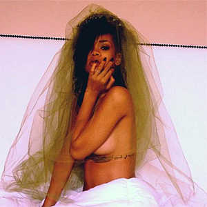 Rihanna brags about designer gifts and posts another topless pic on Twitter   