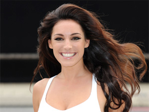 Kelly Brook and Holly Willoughby `kiss` on Celebrity Juice set