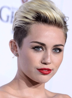 Miley Cyrus gets Rolling Stone tattoo